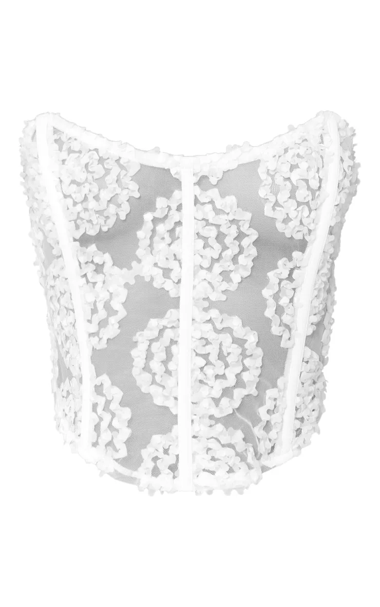 Corset blanc fleuri en mousseline de soie à liserés structurants